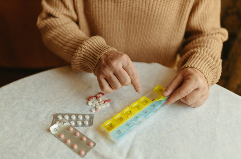 A person sorting their medication.