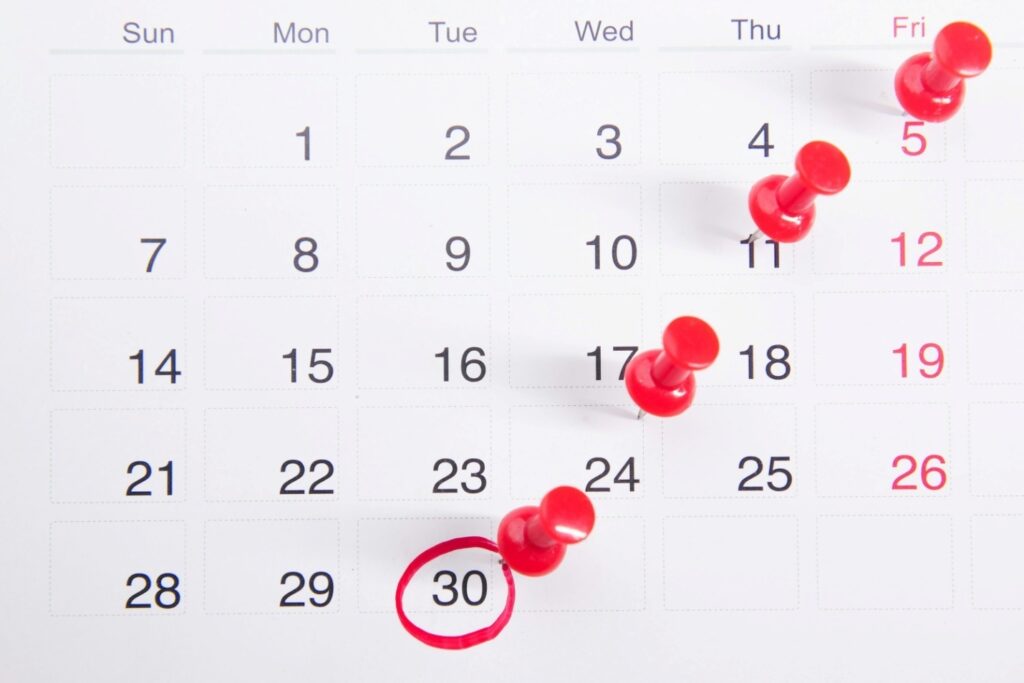 A close-up of a calendar with important dates circled