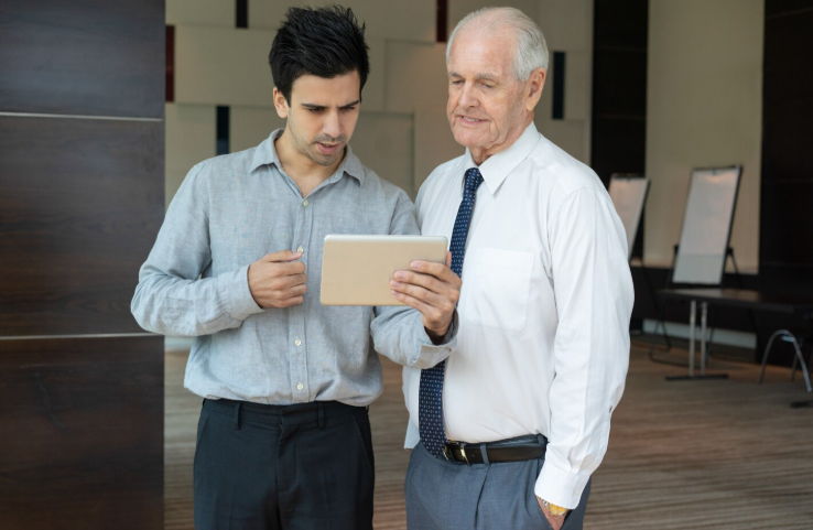Senior Asian man reviewing Medicare options for ongoing heart disease care