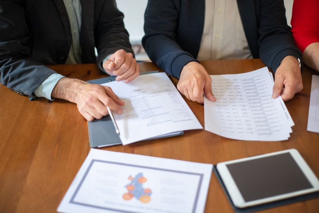 Older couple reviewing Medicare papers with an Advisor