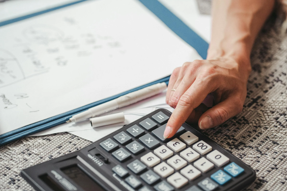 A person calculating insurance coverage.
