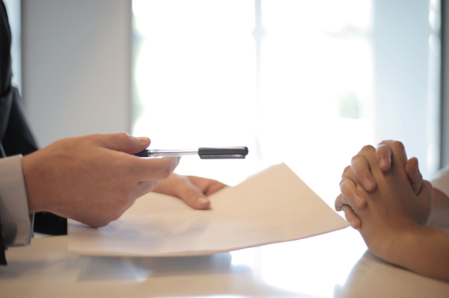 A person signing up for senior life insurance in Georgia.
