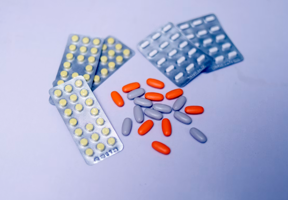 Prescription medication scattered on a surface.