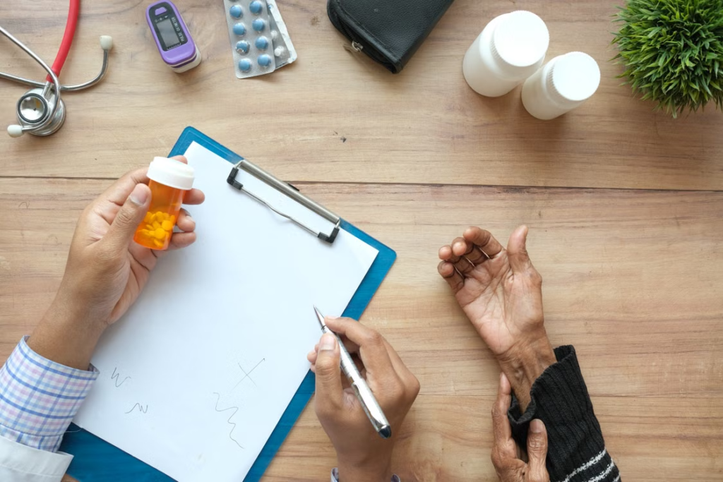 A person writing on a paper attached to a clipboard while holding a container of medicines
