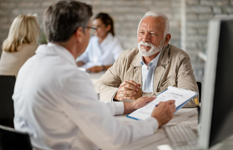 Asian senior man discussing hospital indemnity and supplemental insurance coverage