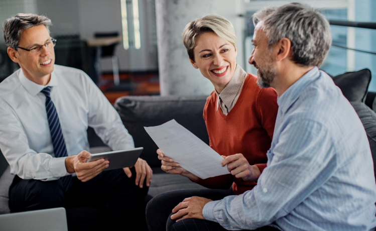 Multicultural couple reviewing supplemental insurance options alongside Medicare