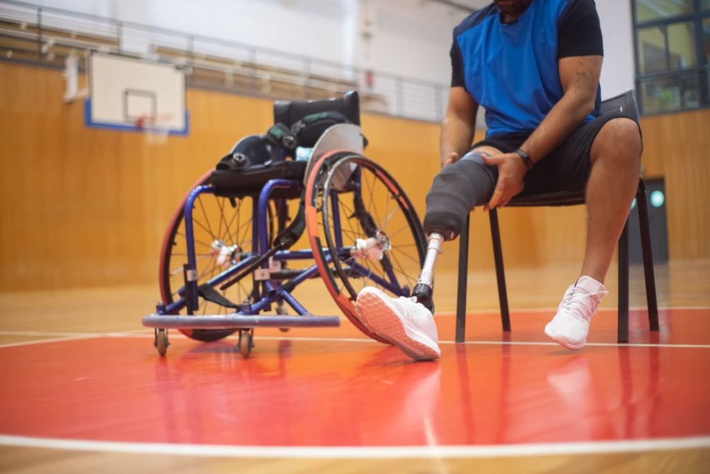 A person with a prosthetic leg on a basketball court 
