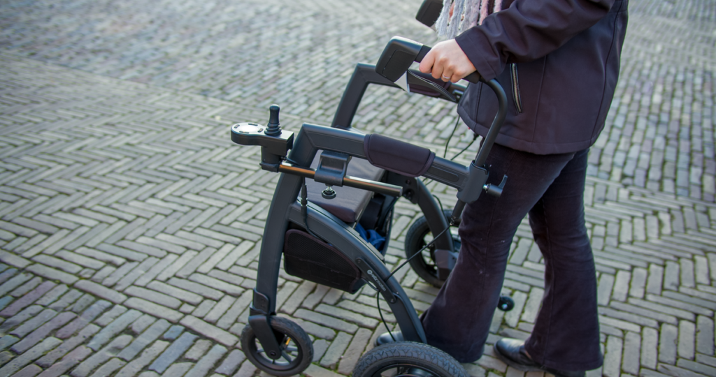 A person using a roller walker 