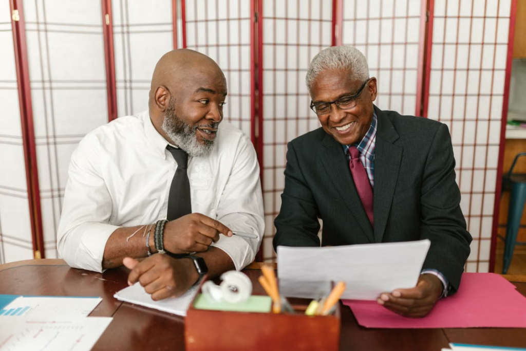 Veteran couple reviewing Medicare enrollment options at age 65